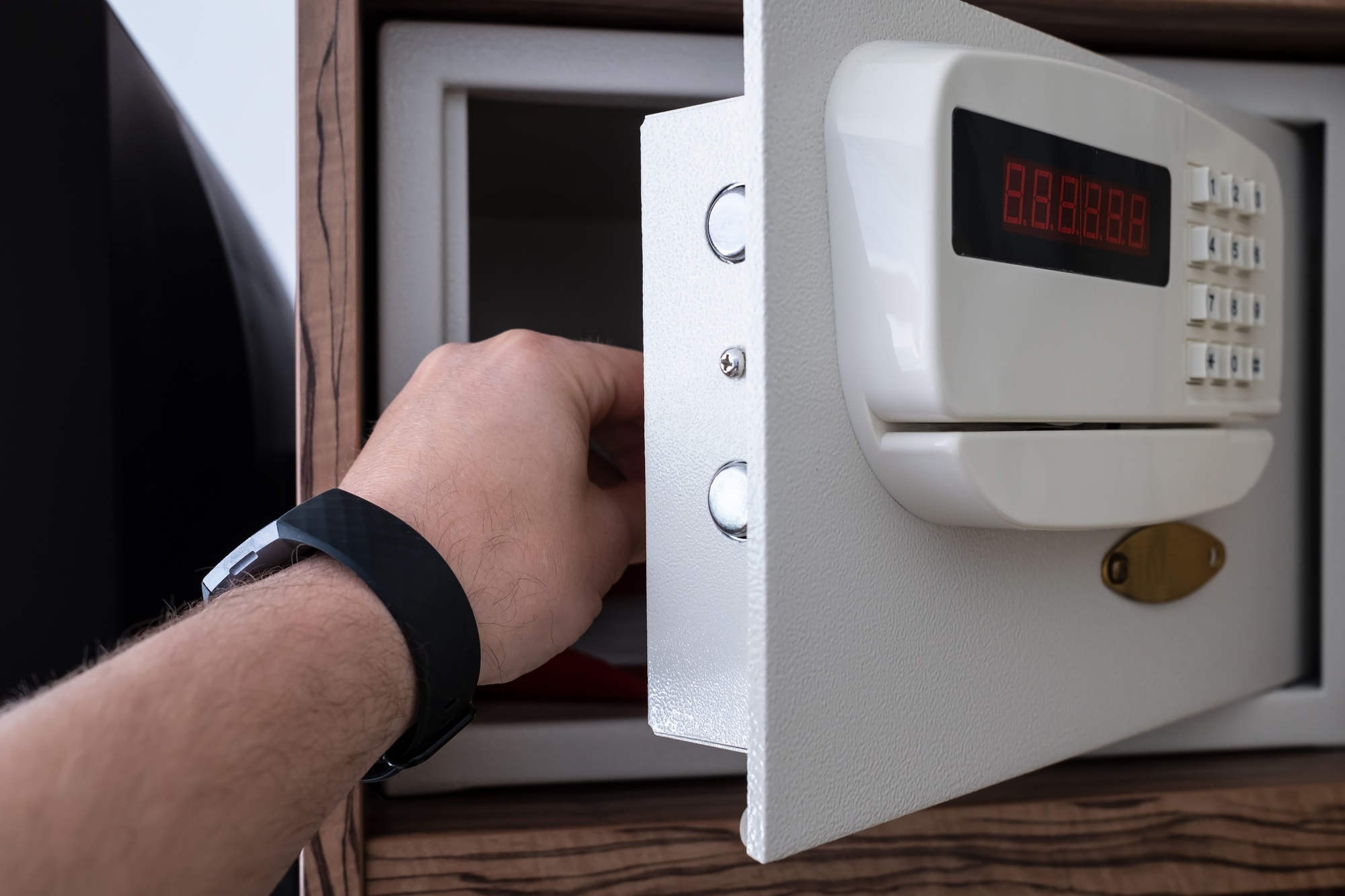 strongbox safe with buttons in a hotel room on a shelf